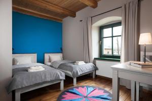 Postel nebo postele na pokoji v ubytování Gościniec Pod Gruszą