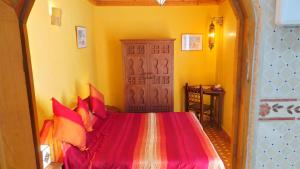 Ένα ή περισσότερα κρεβάτια σε δωμάτιο στο Riad Dar Zouhour