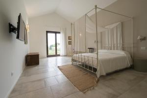 Postel nebo postele na pokoji v ubytování Masseria Fontana di Vite