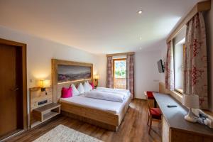 Ένα ή περισσότερα κρεβάτια σε δωμάτιο στο Pension Alpenrose