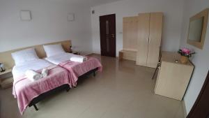 Posteľ alebo postele v izbe v ubytovaní Apartamenty Kozienice