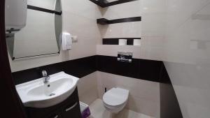 Kúpeľňa v ubytovaní Apartamenty Kozienice