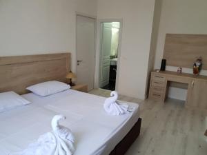 Postel nebo postele na pokoji v ubytování Hotel Livia