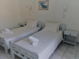 Postel nebo postele na pokoji v ubytování Hotel Faros