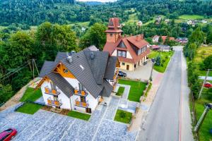 an overhead view of a large house with a road at Willa Na Skarpie in Szczawnica