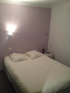 Postel nebo postele na pokoji v ubytování Hotel Restaurant La Frégate