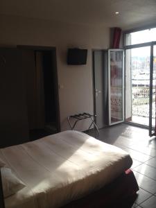 Postel nebo postele na pokoji v ubytování Hotel Restaurant La Frégate