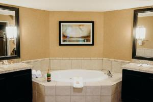 a bath tub in a bathroom with two sinks at Gold Country Casino Resort in Oroville