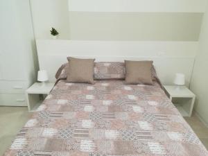 Postel nebo postele na pokoji v ubytování Guest House B&B Via Marina