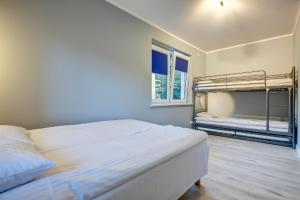 Postel nebo postele na pokoji v ubytování Lazurowa Bryza + 30 fotografií