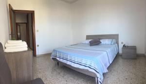 Posteľ alebo postele v izbe v ubytovaní Casa Amelia