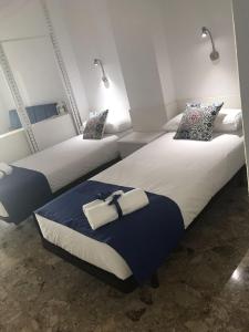 Un pat sau paturi într-o cameră la Apartamentos 306 -05 vista Teide