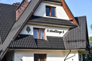 a building with a sign that reads uskitzker at Willa u Słodkiego in Zakopane