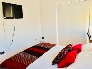 Rúm í herbergi á B&B Hostel CasaMoro