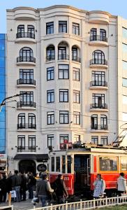 a tram in front of a tall building at Taxim Hill Hotel in Istanbul