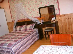 Postel nebo postele na pokoji v ubytování Nadeuri Pension