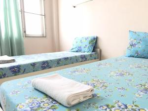 Кровать или кровати в номере NAT 2 Guest House