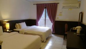 Letto o letti in una camera di 知本溫泉の旅宿