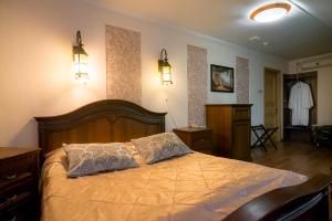 Säng eller sängar i ett rum på Hotel Incanto