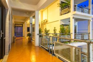 a hallway of an apartment building with a balcony at Good Dream Hotel (Khun Ying House) in Ko Tao