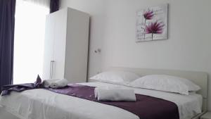 Postel nebo postele na pokoji v ubytování Apartmani Marija Mljet