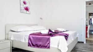 Postel nebo postele na pokoji v ubytování Apartmani Marija Mljet
