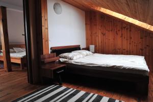 Ένα ή περισσότερα κρεβάτια σε δωμάτιο στο Ranczo Sielanka