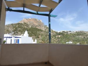 a view from a balcony with a mountain in the background at ARONIS Studios in Kapsali