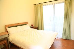 Una cama o camas en una habitación de Sapientia