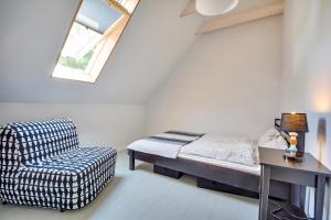 Postel nebo postele na pokoji v ubytování Skandynawskie Domy