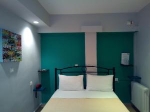 Posteľ alebo postele v izbe v ubytovaní Zappion Hotel