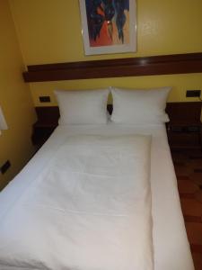 Voodi või voodid majutusasutuse Hotel Ricci toas