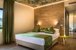 Ein Bett oder Betten in einem Zimmer der Unterkunft Hotel Vinotel Gospoja