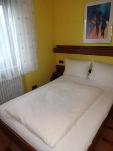 Voodi või voodid majutusasutuse Hotel Ricci toas