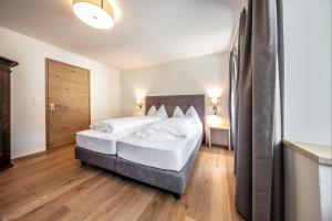 Postel nebo postele na pokoji v ubytování Hotel Münsterhof