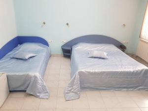 A bed or beds in a room at Hotel Royal