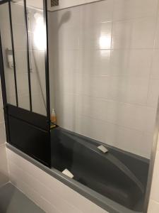 a bathroom with a mirror and a black sink at villa tsétsé in Montpellier +15 photos