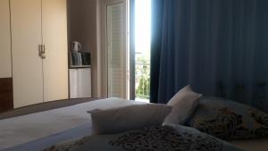Łóżko lub łóżka w pokoju w obiekcie Rooms Raos
