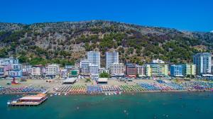 an aerial view of a city with a beach and buildings at Hotel Fredi Shengjin in Shëngjin