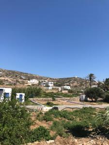 a view of a desert with houses and trees at Vegera Apartment 'Ostria', Stavros Donoussa in Donoussa