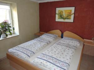 Ein Bett oder Betten in einem Zimmer der Unterkunft Ziegelei-Lübars