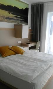 Postel nebo postele na pokoji v ubytování Jurman Apartment