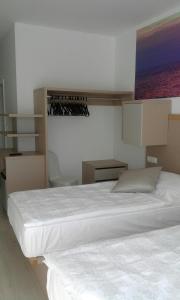 Postel nebo postele na pokoji v ubytování Jurman Apartment