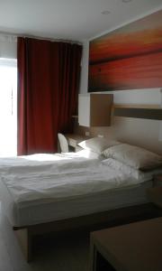 Postel nebo postele na pokoji v ubytování Jurman Apartment