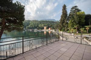 a balcony with a view of a river at Il Golfo Apartment in Lenno