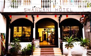 a shanghai hotel with a sign on the front of it at Shangani Hotel in Zanzibar City