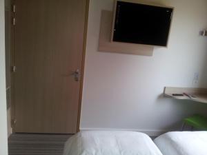 Postel nebo postele na pokoji v ubytování Fasthotel Dunkerque