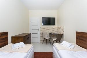 Łóżko lub łóżka w pokoju w obiekcie Apartamenty Dom Saski 10 minut od Centrum Warszawy