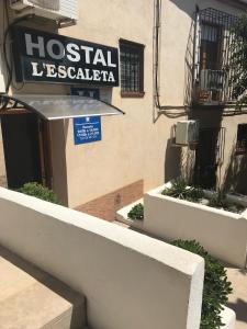 a hospital sign on the side of a building at Hostal L'Escaleta in Oropesa del Mar