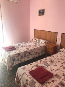 Postel nebo postele na pokoji v ubytování Hostal L'Escaleta